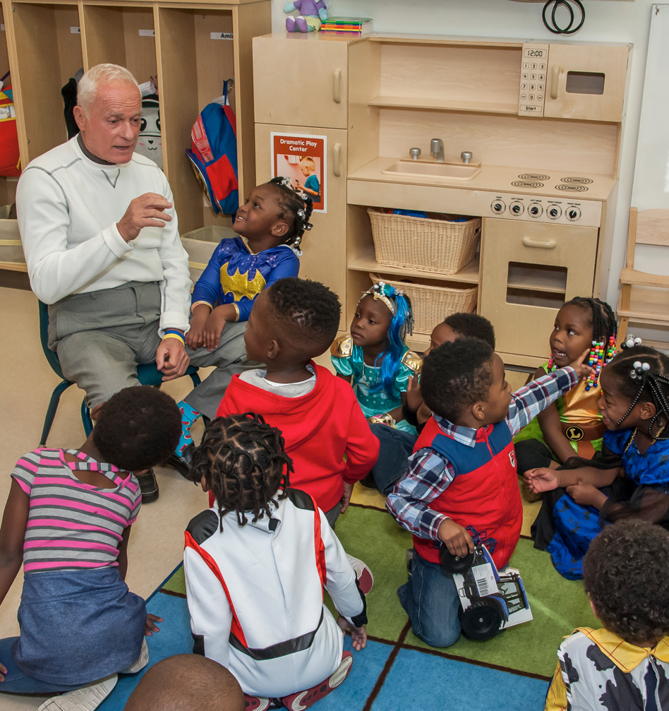 Mr Rosen Sitting with Kids at Parramore